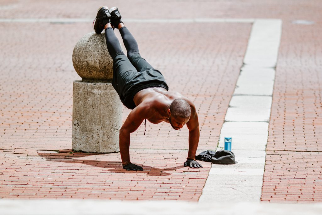 The Best Health and Fitness Books - Man doing push ups outside