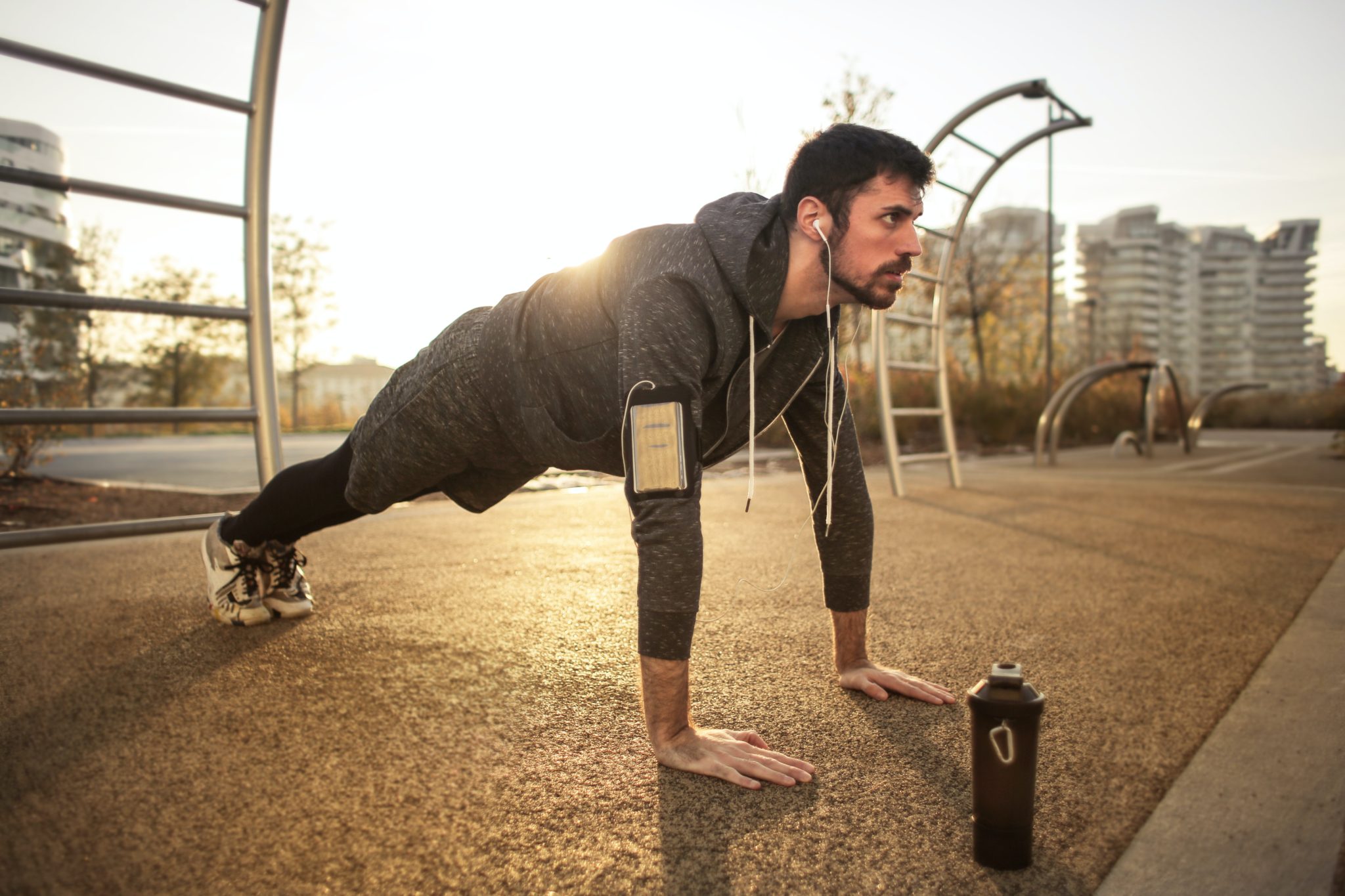 Man doing push-ups in an outdoor gym