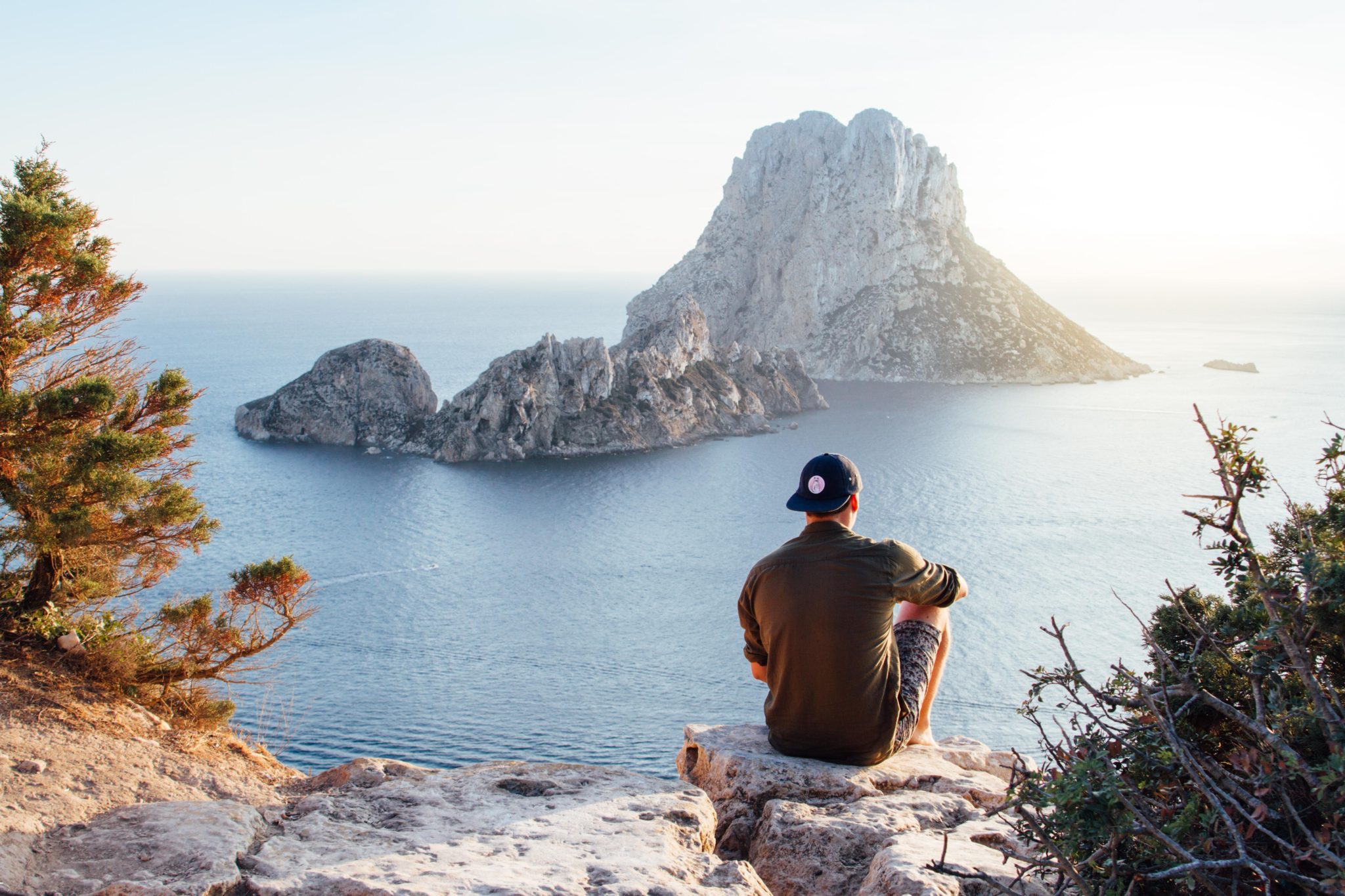 Sixpack Saturday #27 - Man sits and watches and coastline and mountain